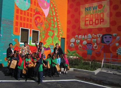 children standing in front of mural