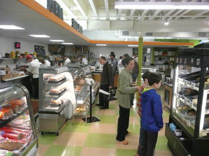 people in line at a deli counter