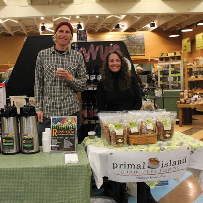 man and woman behind display table